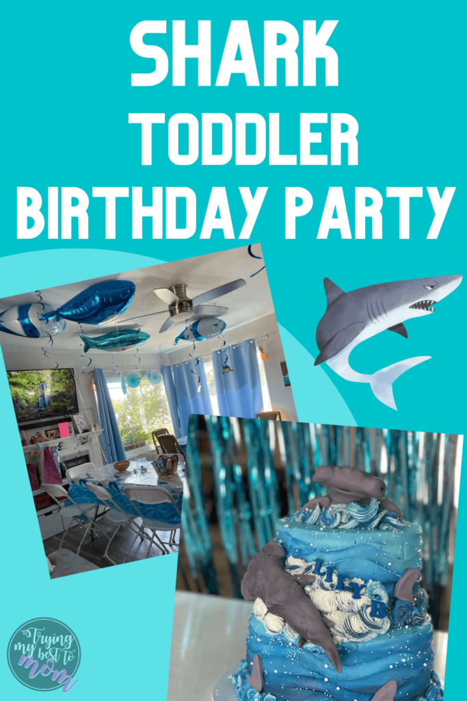 hammerhead shrak cake and shark decorations with text shark toddler birthday party 